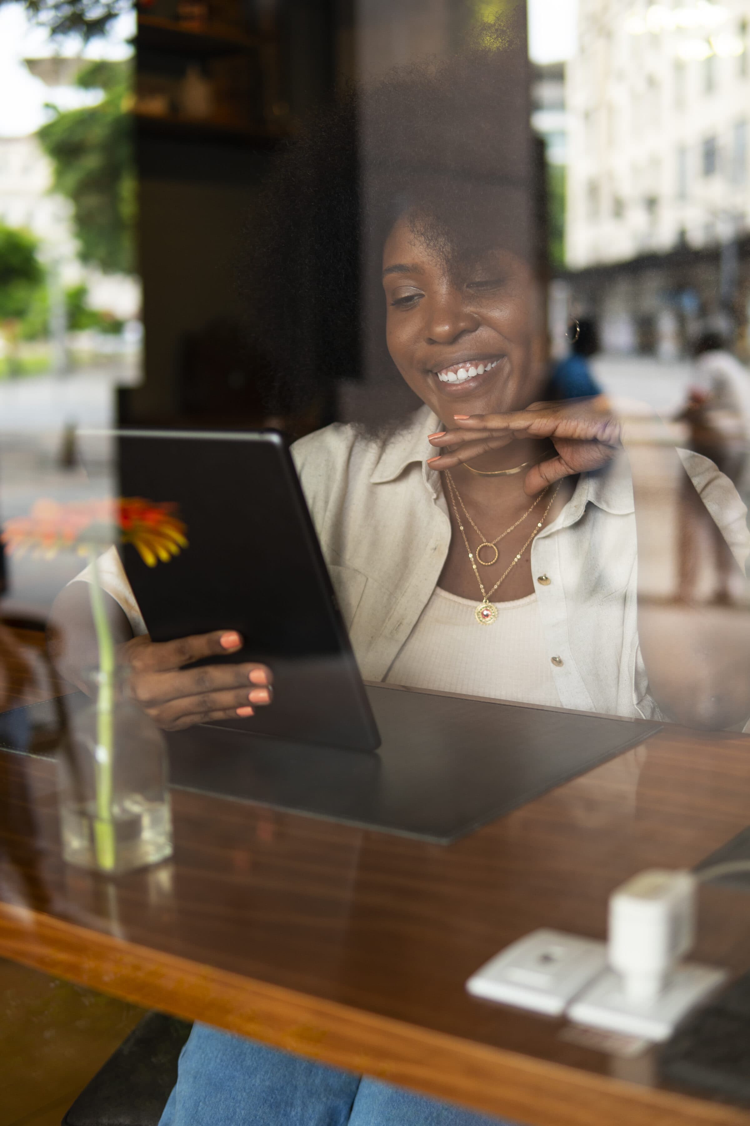 Namibian business owner reading her tablet